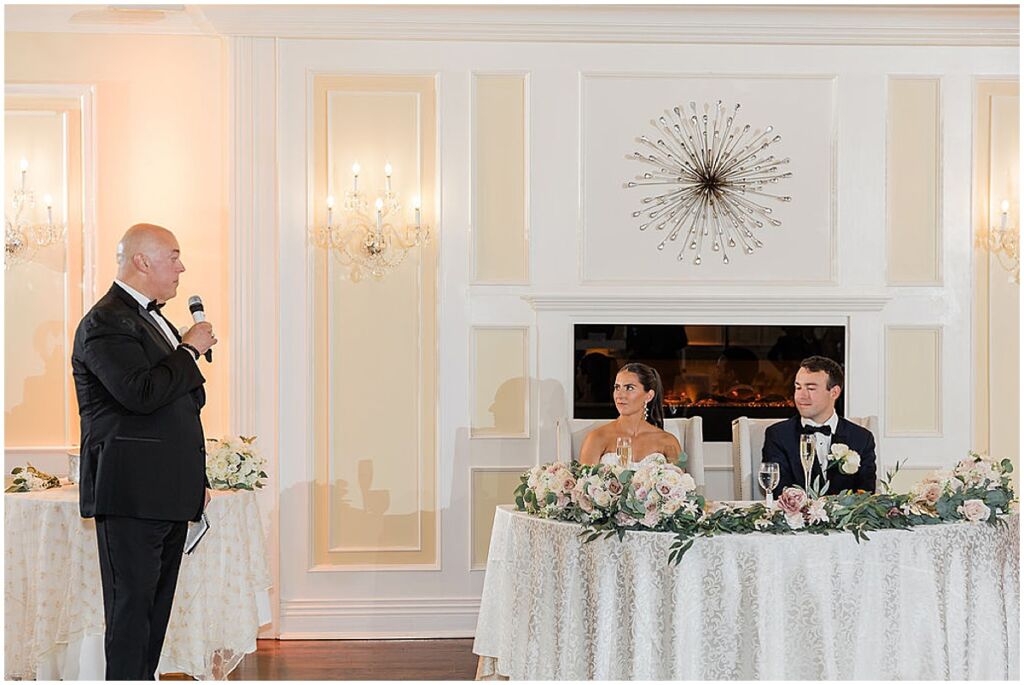 bride and groom listening to toasts at Soundview Caterers wedding reception